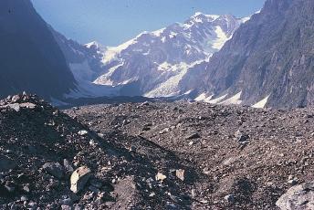 Figure 3.33The moraine in the foreground of this picture was deposited when the valley was filled by a large glacier; the remnants of this Alpine glacier are seen in the background.