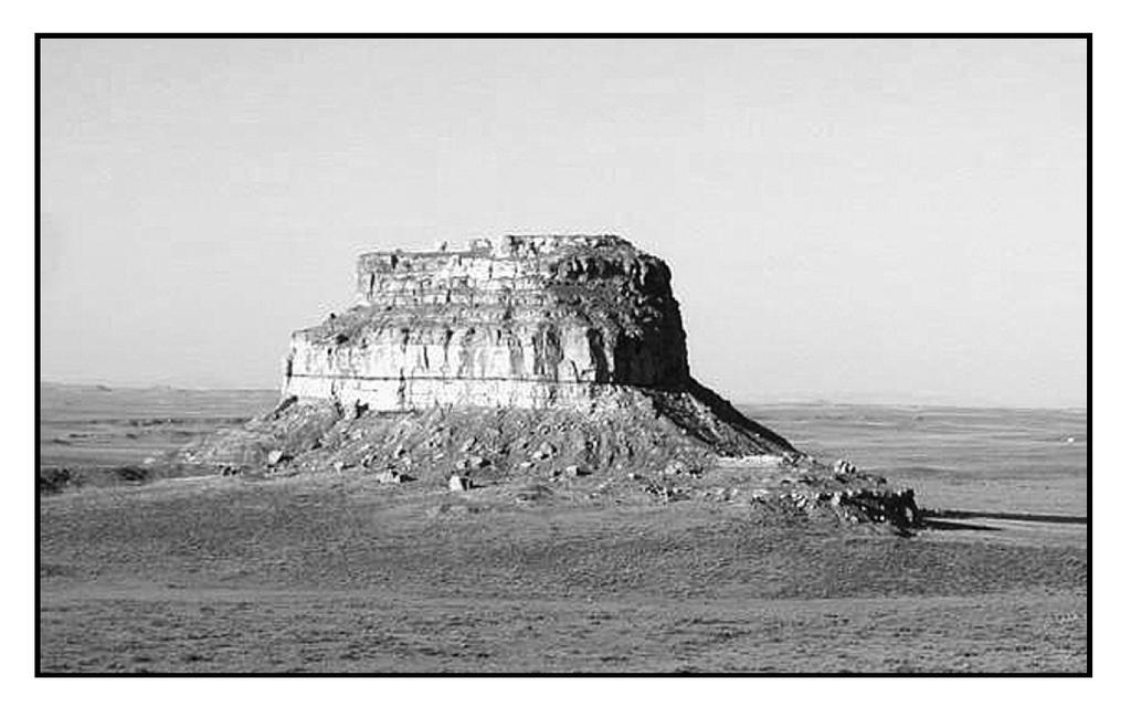an arid region. Which agents of erosion are currently changing the appearance of this butte?