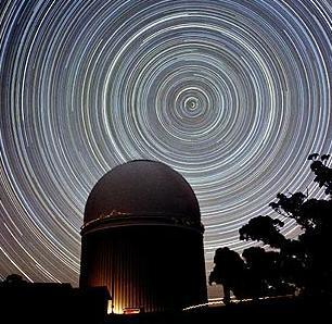 star trails from circumpolar constellations rotate counterclockwise around the north