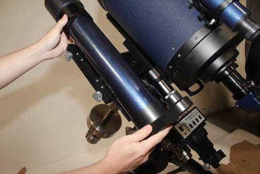 Maintaining a firm grip on the OTA, tighten the two (2) lock-knobs on the dovetail adapter to a firm feel. Attach Diagonal and Eyepiece Remove the dust cap from the rear cell of the telescope.