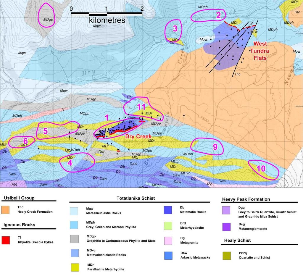 Figure 2: Location of the Dry Creek and West Tundra Flats VMS deposits (purple shape of mineralisation projected to surface) with drill hole traces and priority EM conductors on DGGS geology map