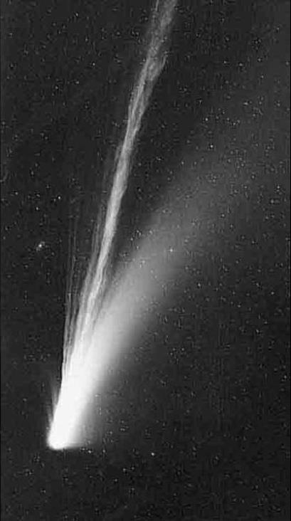 Two tails: Ion tail: ionized gas pushed away from the comet by the solar wind.