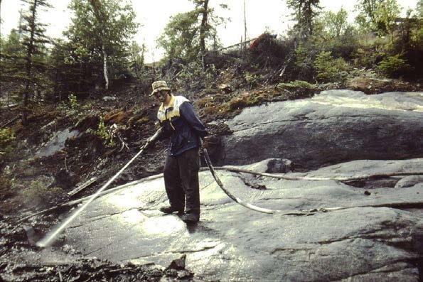 Mechanized surface stripping is commonly done when there is not enough exposed bedrock for geologists to examine adequately.