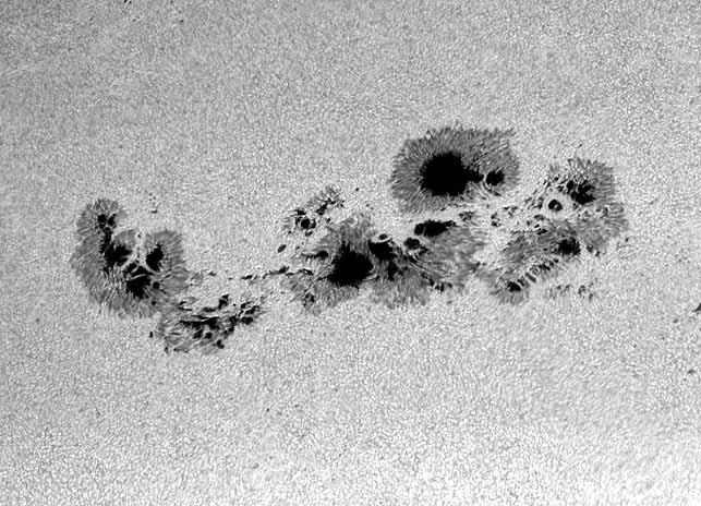 Figure 19.2: A large, complex group of sunspots. photosphere are cooler than the rest of the Sun s surface.