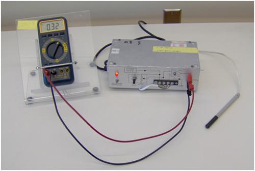 Figure 6: Close up of the Hall probe and readout. (The Hall probe is the pencil-like device to the right.) 6 The total shift will be a few millivolts.