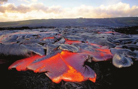 Basalt Flows Along divergent plate boundaries and in isolated hot spots, such as under the Hawaiian Islands, lava flows smoothly onto Earth s surface.