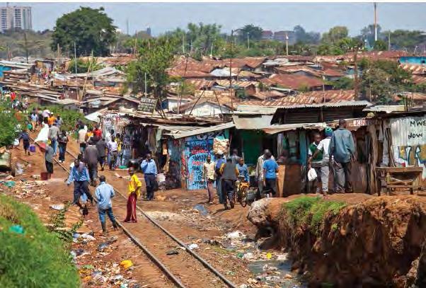 GCSE GEOGRAPHY Sample Assessment Materials 14 (c) Study the photograph below. It shows an informal settlement in a Low Income Country. Photograph 2.