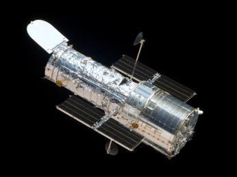 THE HUBBLE SPACE TELESCOPE Orbiting about 600 km above Earth, the Hubble Space