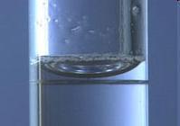 What is the volume of water in the cylinder? ml What causes the meniscus?