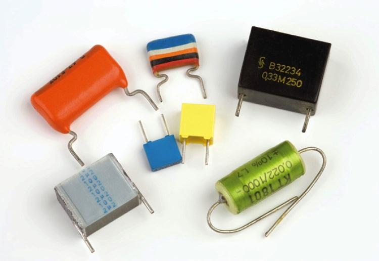 Dielectrics Most real capacitors contain two metal plates