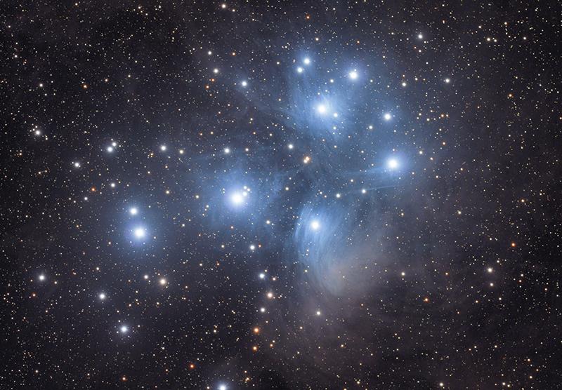 About seven stars stand out as the brightest in the cluster, and is why the cluster is also known as the "Seven Sisters," alluding to the Pleiades, or Seven Sisters from Greek mythology.