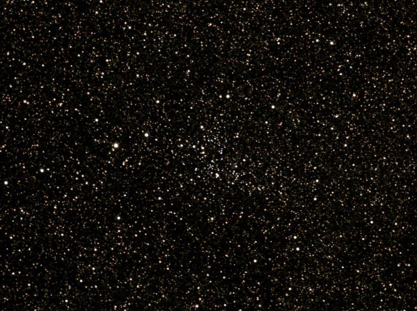 Most of the scores of stars in my image are mag. 13 and fainter. I viewed and imaged the cluster on July 27, 2011. Viewing was through a 70mm (2.