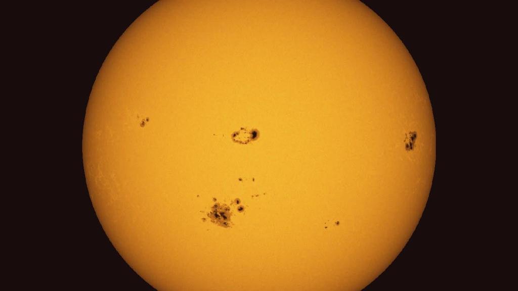 THE PHOTOSPHERE SUNSPOTS Sunspots appear dark because they are cooler than the