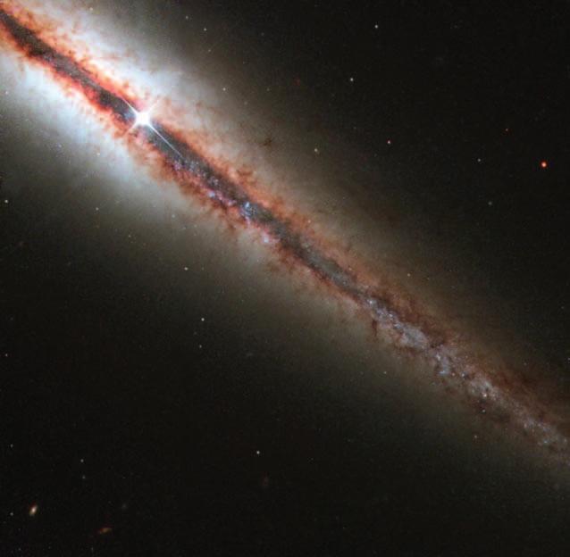 8 The Universe FIGURE 1. 3 Edge-on view of the spiral galaxy NGC 4013 that lies about 55 million light-years from Earth.
