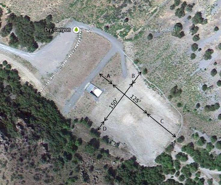 Figure 7. An aerial view of the existing detention basin at the mouth of Dry Canyon. The bottom of the basin (125 x150 ) is level ground.