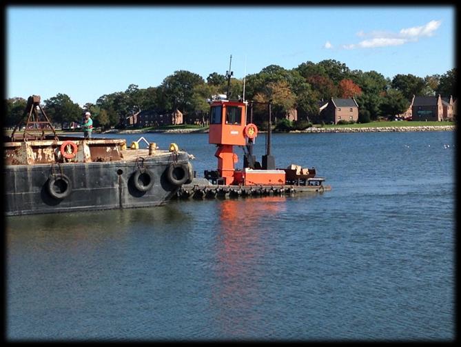 Equipment is moved around the Cove using a 500 HP push-boat.
