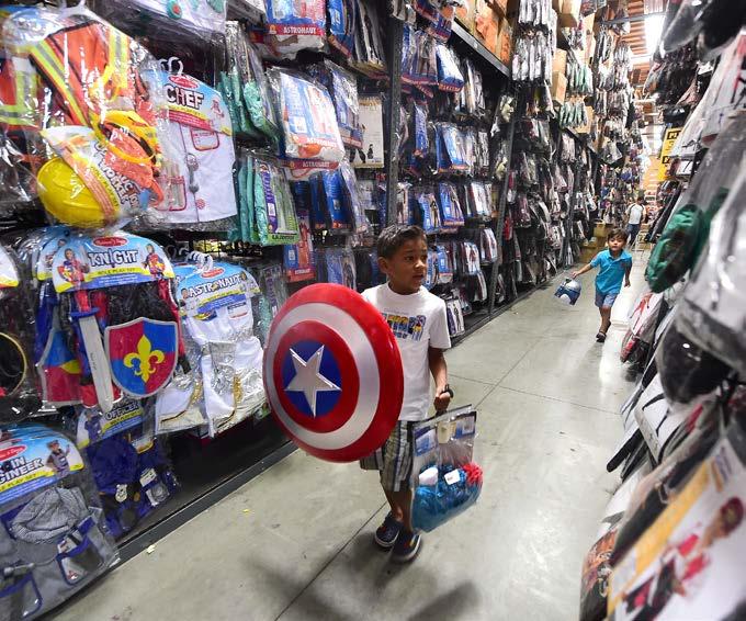 Modern-day druids perform a blessing at Stonehenge in southern England. A boy shops for his Captain America costume at a costume store store in Montebello, California.