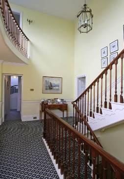 The reception hall has a sweeping staircase, leading to a wonderful galleried first floor landing, as well as double doors to the main reception rooms.