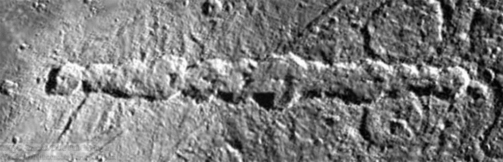 Two chains of impact craters on Earth s moon