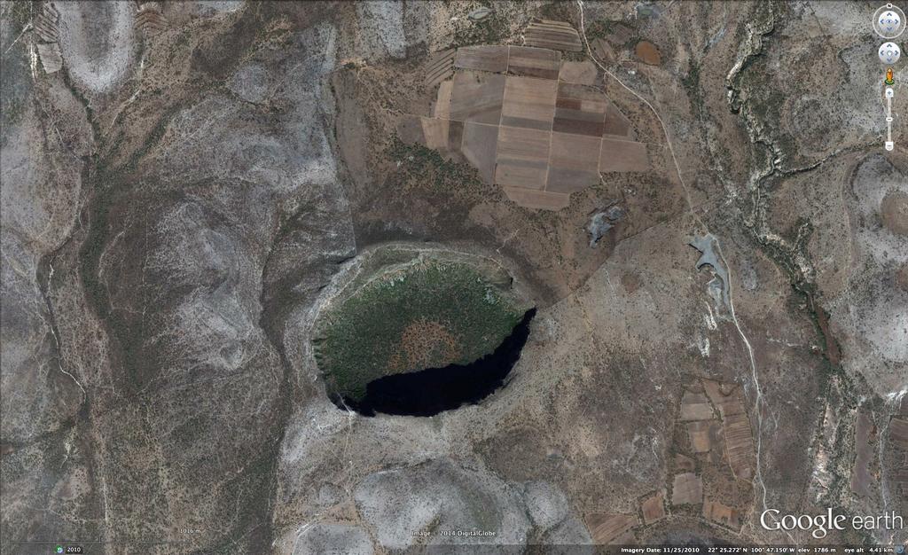 Fig. 3. Satellite image of Joya Honda. The crater is elliptical and its long axis is perpendicular to the Laramide folds in the country rocks.