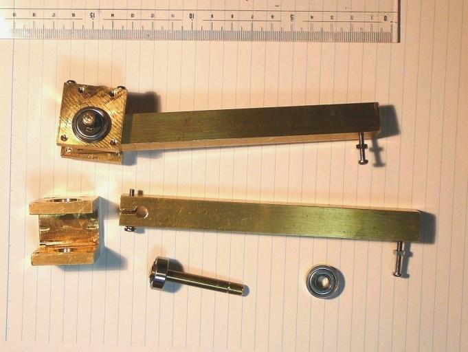 This method allowed slight gap remain between the E-rings and bearings, and could not control the tightness to fix the bearings to the brass block.