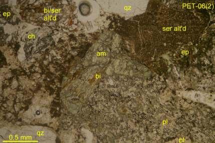 23 PET-06(2): Widely varying, closely packed (clast-supported) subrounded/subangular clasts ranging from fine-grained, biotite (bi), sericite (ser) or epidote (ep) altered