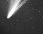 Comets originate from the Oort cloud, a large spherical cloud of icy aggregates, or from the Kuiper Belt, a disk-shaped region of icy bodies.