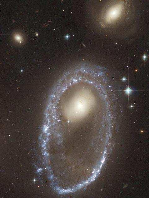 Ring or Splash Encounters A fast-moving smaller galaxy passes through the center of a larger disk galaxy Results in a tidal ring Circular density wave