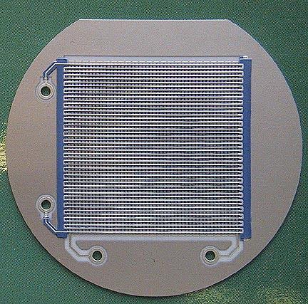 Fig. 3. 29 mm cross delay line anode with plated through contact holes for the delay line signals. Fig. 4.