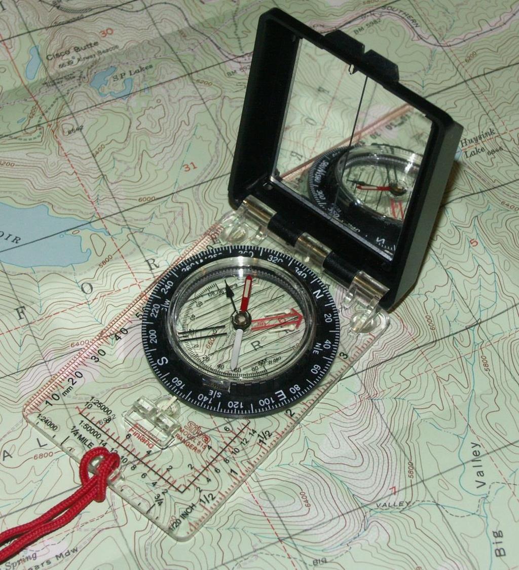 The Compass Magnetic needle: North is usually red Rotating bezel with orienteering arrow/lines and degree markings Boxing the needle Sight line and index