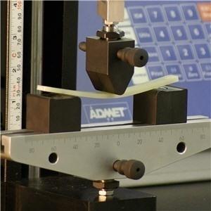 Figure 3.17 Flexural test apparatus - Three point loading The maximum fiber stress at failure on the tension side of a flexural specimen is considered the flexural strength of the material.