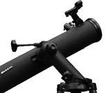 2) DURING THE DAY LIGHT HOURS, AIM THE MAIN TELESCOPE AT AN OBJECT AT LEAST 1/ 4 MILE OR MORE IN THE DISTANCE AND BRING IT INTO FOCUS.