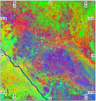 Decorrelation stretch of bands 7-4-2 from Landsat TM 5 data to show oxide dispersion as red to orange color, vegetation as