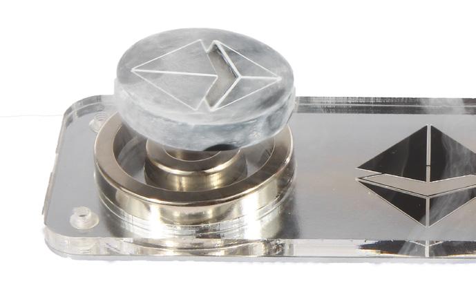 Shift the superconductor sideways to emphasize that it rotates around the magnet axis and not around its center.