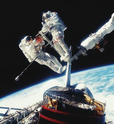 Astronauts take space walks to pick up objects. They bring them back to a spaceship.