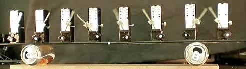 currently, Pantaleone 2 investigated a similar setup in which metronomes were placed on a common support which was free to roll across cylinders, allowing coupling through the low-friction horizontal