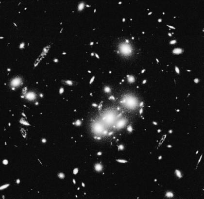 Mass from galaxy motions in a cluster is about 50 times larger than the mass in stars! 2.