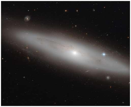 Lenticular galaxy: has a disk like a spiral galaxy but much