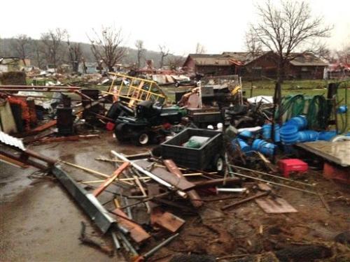 Debris litters the area after a storm swept through the area and damaged homes in Sand Springs, Okla.