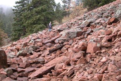 Bedrock or regolith falls rapidly downward.