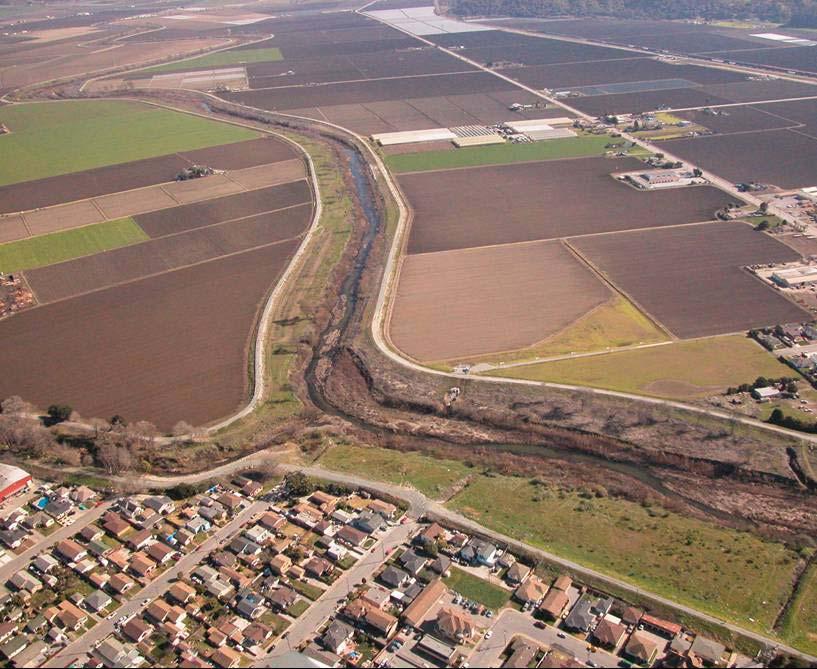 Figure 3: Aerial photograph of confluence of Pajaro River and Salsipuedes Creek illustrating the levees, main channel with sand bars, and the very small