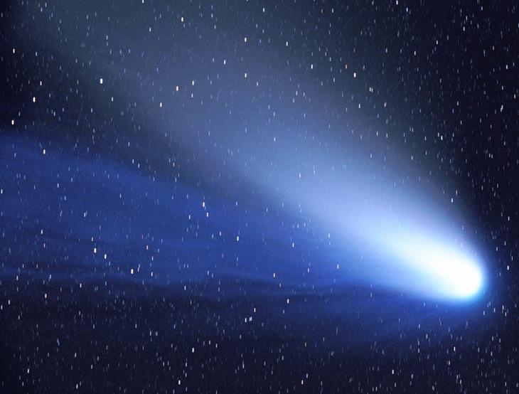 The Dust and Ion Tails of Comet Hale-Bopp