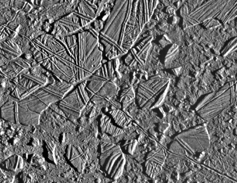 33 Europa and Tidal Heating Europa also has a density close to 3.0 g/cc. The outer layer of ice is the top of a true frozen-over ocean about 100 kilometers deep.