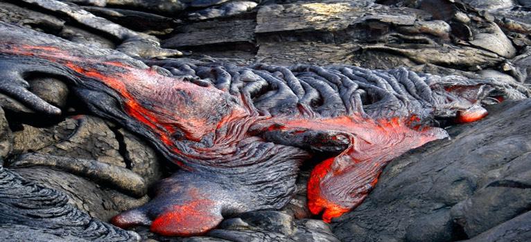 Basaltic Lava Flows! Mafic lava very hot, low silica, and low viscosity! Basalt flows are often thin and fluid. " They can flow rapidly (up to 30 km per hour).