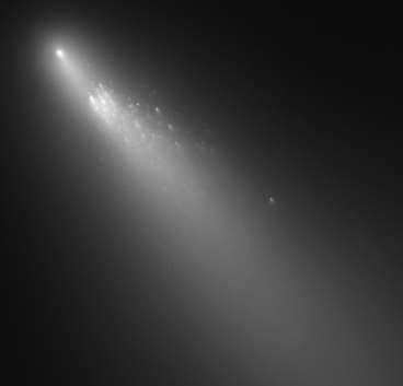 stream of visible particles known as the tail of the comet.