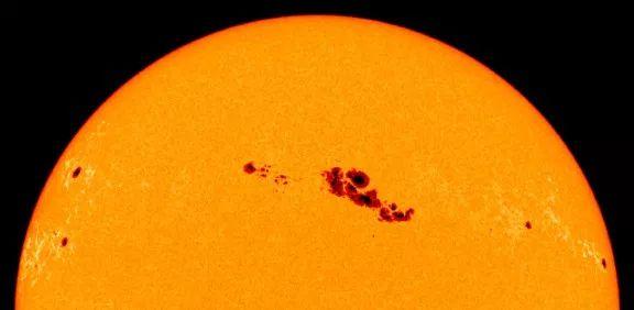 Sunspots Sunspots can be very large, up to 50,000 kilometers in diameter. They are caused by interactions with the Sun's magnetic field.