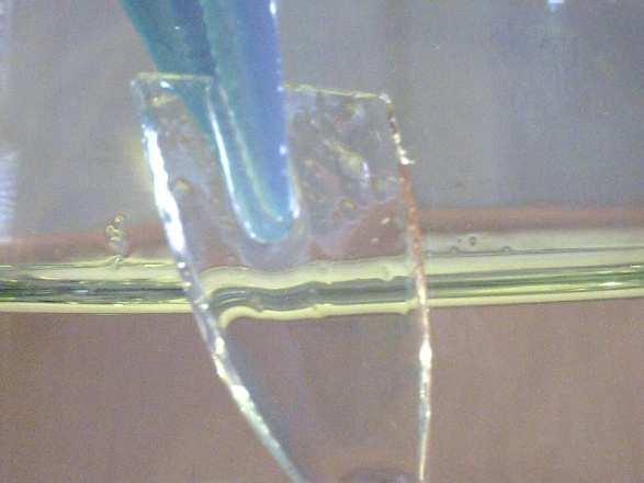 Refractive index of small pieces of glass can be determined using