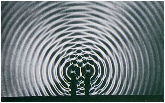 Two sources do not have to be in phase to produce interference patterns. Similar interference patterns can be produced by any two sources whose phase difference remains constant.