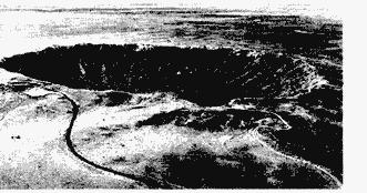 132. The photograph below shows a large crater located in the southwestern United States. Some fragments taken from the site have a nickel-iron composition.