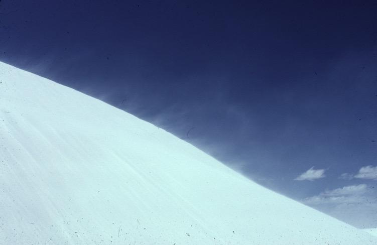 Sand blowing over cornice of a sand
